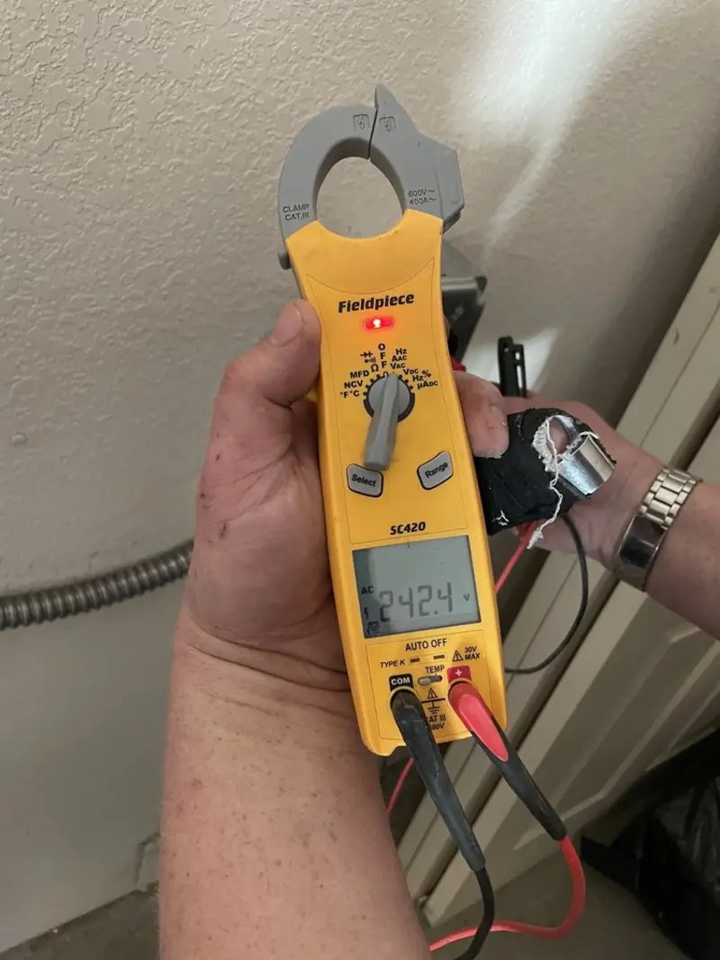 Voltage testing with clamp meter during Whole House Surge Protector in Hogansville